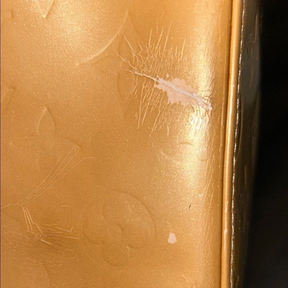 LOUIS VUITTON Gold Tote with Iconic Embossed Design